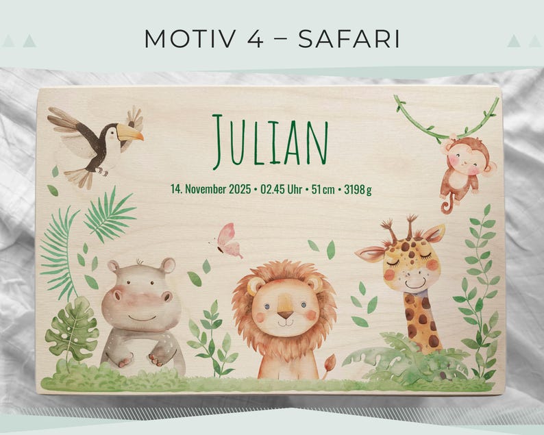 May include: Wooden plaque with a safari theme, featuring a toucan, monkey, hippo, lion, and giraffe. The name "JULIAN" is written in green, along with the date, time, and measurements: 51 cm and 3198 g.