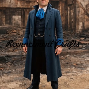 May include: A long, navy blue coat with a double-breasted design, paired with a matching vest and black trousers. The coat features blue cuffs and a high collar, complemented by a blue ascot. The image includes the text "Reenactment Crafts".