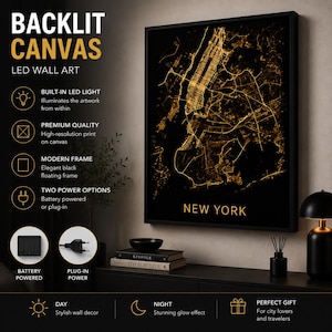 May include: A rectangular backlit canvas wall art piece featuring a gold-colored map of New York City on a black background, encased in a black frame. The artwork is illuminated from within by built-in LED lights, displaying the city grid.