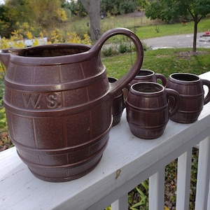 Redware Barrel Shaped Pitcher and 4 Barrel Mugs