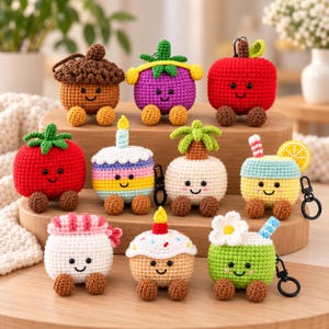 May include: A collection of nine crocheted cases for wireless earbuds, each featuring a unique character design including an acorn, purple fruit, red apple, tomato, birthday cake, palm tree, drink with lemon, sushi, and a flower-topped drink.