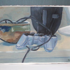 May include: An oil painting depicts a blue video game controller with a black cord, a dark object, and a decorative bowl. The painting also includes two red books and a brass candle holder with a white candle.