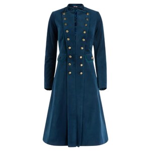 May include: A teal-colored long coat with a double-breasted design. The coat features gold-colored buttons, a mandarin collar, and two front pockets with green trim. The coat has long sleeves and a flared skirt.