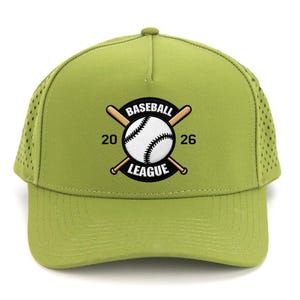 May include: A light green baseball cap with a curved brim and mesh side panels. The cap features a baseball league logo with a baseball and crossed bats, and the text "BASEBALL LEAGUE 20 26".
