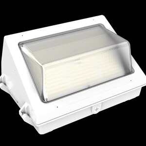 May include: White outdoor wall light fixture with a clear, ribbed plastic cover. The light has a rectangular shape with a sloped top and is designed for exterior use. The fixture is mounted on a white base.