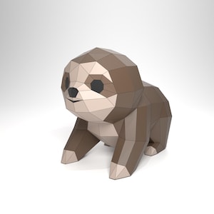 May include: A geometric papercraft sloth figurine in shades of brown and beige. The sloth has a polygonal design with black eyes and a small smile. The figurine is posed in a sitting position.