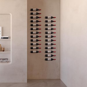 May include: A wall-mounted wine rack displaying numerous wine bottles. The bottles are arranged in rows, with their labels visible. The rack is mounted on a neutral-colored wall, creating a minimalist and modern aesthetic. The bottles are dark with red tops.