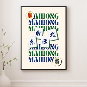 May include: A framed print featuring the word "MAHJONG" in green and blue, with Chinese characters and Mahjong tiles. The artwork has a cream background and a black frame, suitable for game room decor.