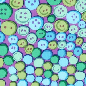 May include: A purple fabric with a repeating pattern of blue, green, and yellow circles. The circles have a button-like appearance with a simple design.