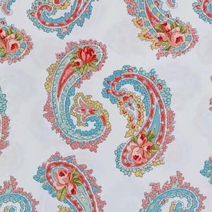 May include: A white fabric featuring a repeating paisley pattern. The paisley elements are in shades of red, pink, blue, and yellow, with floral accents. The design is a classic, vintage style, suitable for textiles or wallpaper.