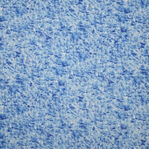 May include: Blue and white fabric with a speckled pattern. The fabric has a textured surface.