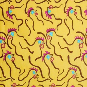 May include: Yellow fabric with a repeating pattern of stylized rooster illustrations. The roosters have brown bodies, magenta combs, turquoise eyes, and a flower detail. The background is a solid yellow color.