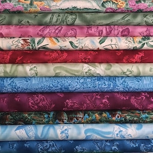 Może przedstawiać: Zestaw trzech ceramicznych kubków z nakrapianym, matowym wykończeniem. Kubki są w odcieniach kremu, jasnoszarym i ciemnoszarym. Każdy kubek ma prosty, minimalistyczny design i zaokrąglony uchwyt.