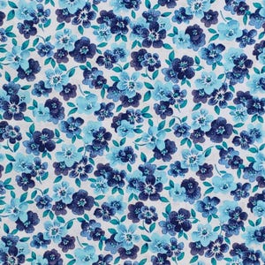 May include: A fabric with a repeating floral pattern. The design features clusters of blue flowers in varying shades, including navy, light blue, and teal, set against a white background. The flowers have multiple petals and are interspersed with small green leaves.