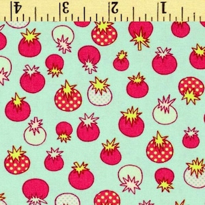 May include: A fabric featuring a repeating pattern of pink strawberries with yellow starburst tops and white polka dots on a pale blue background. The strawberries vary in size and are scattered across the fabric.