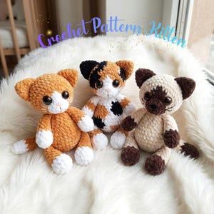 May include: Three plush kitten toys made of soft yarn, featuring the text Crochet Pattern Kitten. The left kitten is orange and white, the center is a calico with black, orange, and white patches, and the right is a cream and brown Siamese style.