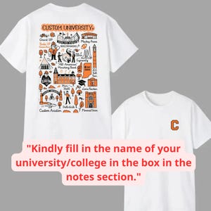 May include: White t-shirts with custom university designs. One shirt features a detailed orange and black graphic with university landmarks and text. The other shirt has a small orange "C" on the chest. The shirts are for a college or university.