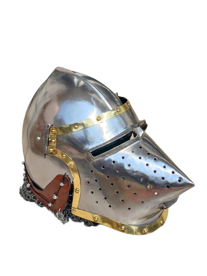 May include: A polished steel helmet with a pointed visor and brass detailing. The helmet has small ventilation holes and brass bands. A leather and chainmail neck guard is attached to the helmet.
