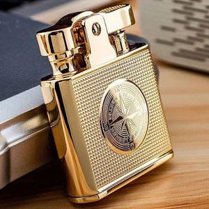 coin cigarette lighter File:Small Vintage Cigarette Lighter in the Shape of an Antique French Coin  (9734986970).jpg