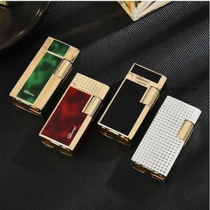 May include: Four rectangular lighters in gold and various colors. One has a green marble design, another a red marble design, a third is black, and the last is white with a textured pattern. Each lighter has the word "Derui" or "Lighter" on it.