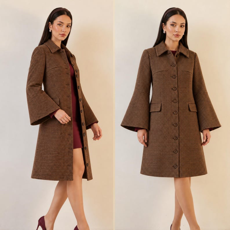 May include: A brown and black houndstooth coat featuring a structured collar, a full-length button-down front, and wide, flared bell sleeves. The coat is knee-length and includes two horizontal flap pockets on the front, worn over a dark red dress.