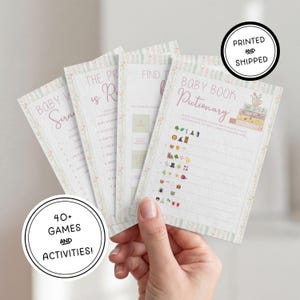 May include: A set of four rectangular baby shower game cards with a floral border. The cards feature text including Baby Word Scramble, The Price is Right, Find the Guest, and Baby Book Pictionary with illustrations of books and various icons.