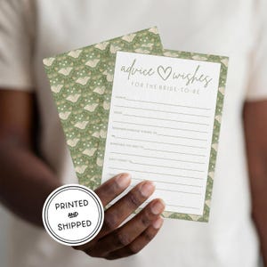 May include: A rectangular advice and wishes card for the bride-to-be with a green background featuring a pattern of open books and small hearts. The card includes printed lines for writing and the text: advice wishes for the bride-to-be.