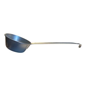 May include: A silver-toned metal ladle featuring a deep, rounded bowl and a long, straight handle that terminates in a curved hook. The kitchen utensil has a smooth, matte finish and a simple, functional design for scooping liquids or food items.