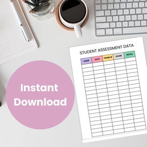 May include: A white sheet of paper titled "STUDENT ASSESSMENT DATA" with a table for student assessment details. A pink circle with the words "Instant Download" is in the lower left. A coffee cup and keyboard are also visible.