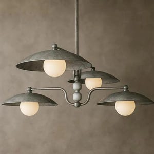 May include: A gray metal chandelier with four lights. Each light has a round, frosted glass bulb and a curved, saucer-shaped shade. The fixture has a central stem and decorative wooden beads.