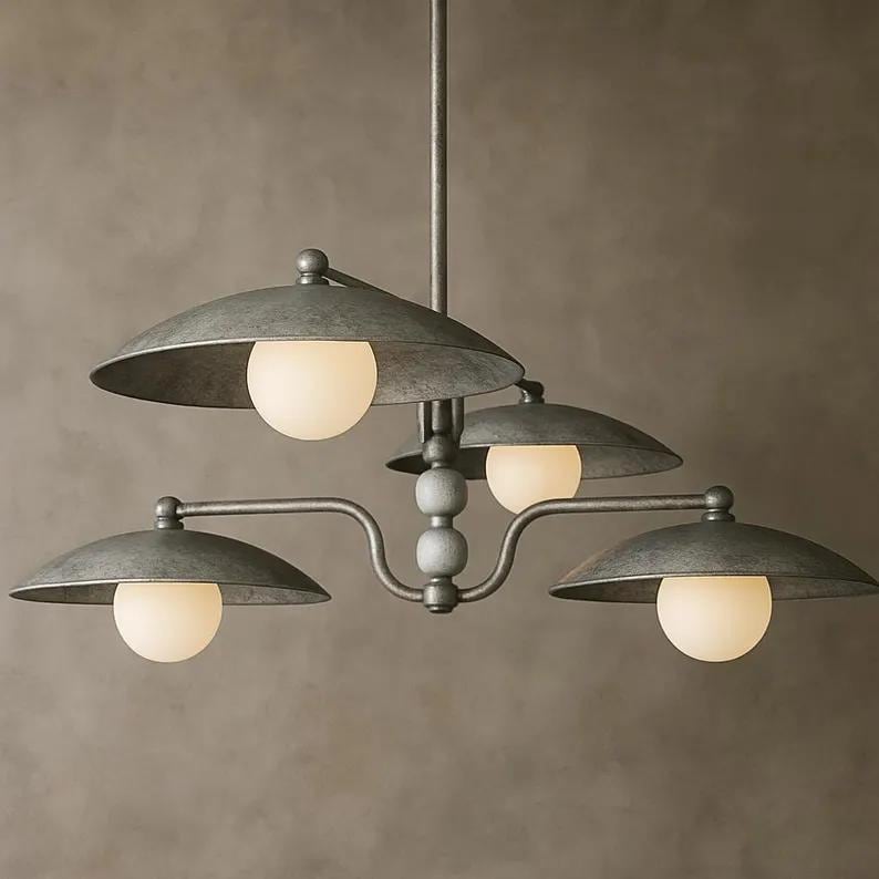 May include: A gray metal chandelier with four lights. Each light has a round, frosted glass bulb and a curved, saucer-shaped shade. The fixture has a central stem and decorative wooden beads.