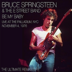 May include: Image of Bruce Springsteen playing a guitar on stage. The text reads "BRUCE SPRINGSTEEN & THE E STREET BAND BE MY BABY LIVE AT THE PALLADIUM, NYC NOVEMBER 4, 1976 THE ULTIMATE REMASTER". Springsteen is wearing a white t-shirt and blue jeans.
