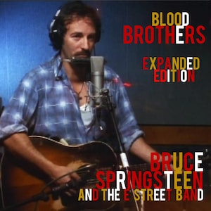 May include: Image of Bruce Springsteen and the E Street Band. The album cover features Springsteen playing a guitar and harmonica in a recording studio. The text on the cover reads "Blood Brothers Expanded Edition."