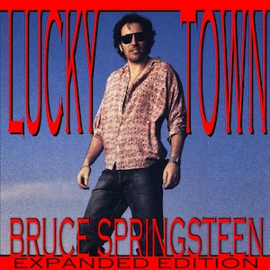 May include: Album cover for "Lucky Town" by Bruce Springsteen. The image features Springsteen wearing sunglasses and a patterned shirt, standing against a blue sky. The album title and artist name are in red text.