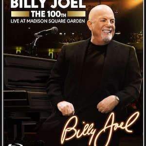 May include: Blu-ray disc featuring Billy Joel's 100th live performance at Madison Square Garden. The cover shows Billy Joel in a black suit, smiling, with the concert title in bold white letters. The artist's signature is in a glowing script.