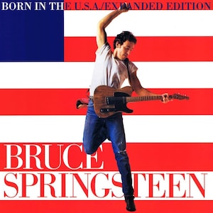 May include: Album cover featuring Bruce Springsteen holding a guitar, with the title "Born in the U.S.A./Expanded Edition" at the top. The background is a stylized American flag. The artist's name, "Bruce Springsteen," is prominently displayed.