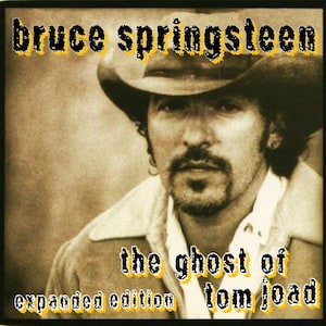 May include: Album cover for "The Ghost of Tom Joad" by Bruce Springsteen. The sepia-toned image features a portrait of Springsteen wearing a cowboy hat and a light-colored jacket. The album title and artist name are displayed in a stylized font.