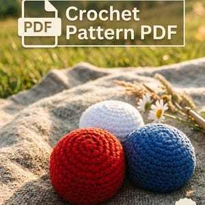 May include: A crochet pattern PDF featuring three crocheted spheres in red, white, and blue. The spheres are arranged on a textured surface with the text "Crochet Pattern PDF" in the upper portion of the image. "Instant Download" is also visible.