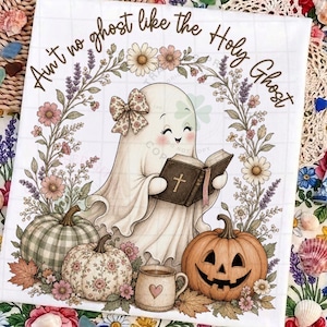 May include: A rectangular print featuring a smiling ghost wearing a floral bow, holding an open book with a cross on the cover. The text reads, "Ain't no ghost like the Holy Ghost." It is surrounded by pumpkins, a mug with a heart, and floral vines.