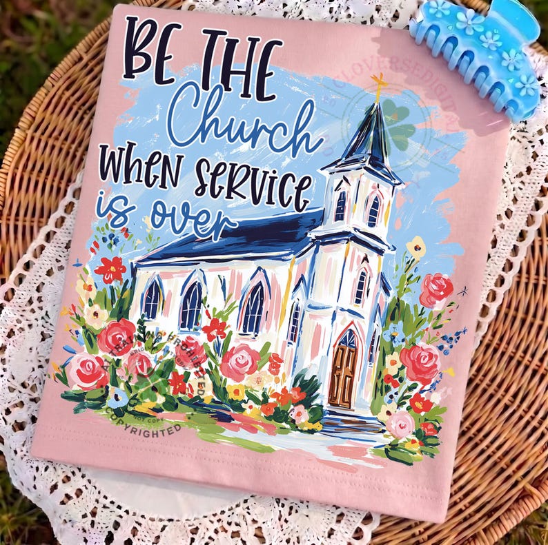 May include: Pink t-shirt with the text "BE THE Church WHEN SERVICE is over" and a watercolor painting of a church surrounded by flowers. A blue hair clip is in the upper right corner.