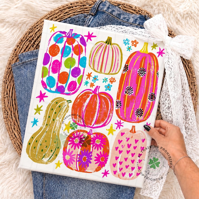 May include: A rectangular canvas print featuring a colourful illustration of six pumpkins in various shapes and sizes. The pumpkins are decorated with vibrant patterns including polka dots, stripes, flowers, and hearts, accented by small yellow and pink stars.