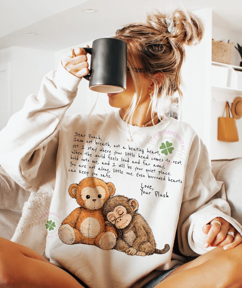 May include: Cream-colored sweatshirt featuring a graphic of two plush monkeys, one brown and one tan, with the text "Dear Punch, I am not breath, not a beating heart..." and "Love, Your Plush."