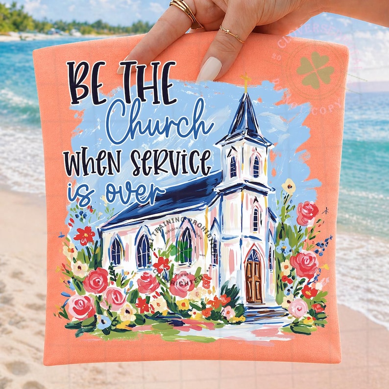 May include: Peach-colored t-shirt with the text "BE THE Church WHEN SERVICE is OVER" above a watercolor painting of a church surrounded by flowers. The church has a blue roof and a gold cross.