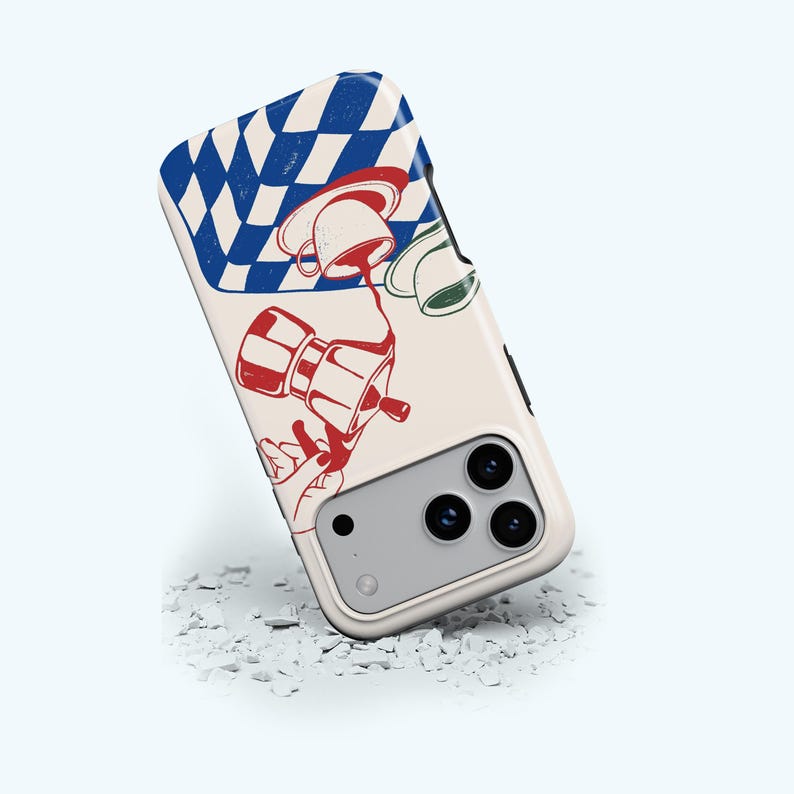 May include: A phone case featuring a cream background and a vibrant coffee-themed illustration. The design incorporates a red and white coffee maker, a blue and white chequered pattern, and coffee cups. The case has a camera cutout and three lenses.