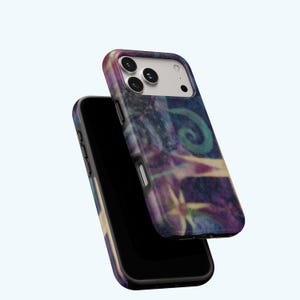May include: Two smartphone cases with a colorful abstract design. The cases feature a swirling pattern of blues, purples, and greens. The design includes a spiral and star-like shapes. The phone cases are black with a glossy finish.