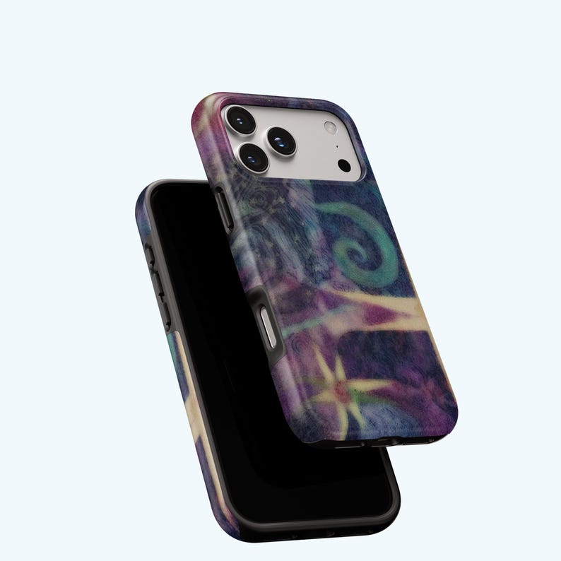 May include: Two smartphone cases with a colorful abstract design. The cases feature a swirling pattern of blues, purples, and greens. The design includes a spiral and star-like shapes. The phone cases are black with a glossy finish.