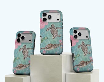 May include: Three phone cases with a sea turtle design. The cases feature a teal background with watercolor illustrations of sea turtles, pink flowers, and bubbles. The cases are displayed on white geometric blocks.