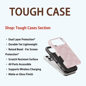 May include: A phone case with a pink floral design, a black interior, and a silver phone. The text "TOUGH CASE" is at the top, with a list of features below, including dual-layer protection and wireless charging support.