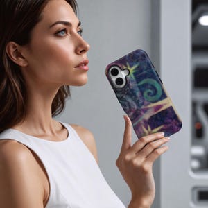 May include: A smartphone case with a colorful, abstract design featuring shades of purple, blue, and yellow. The case has a textured appearance and a camera cutout. The design includes a starburst and swirling shapes.