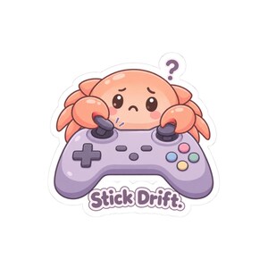 May include: A sticker featuring a peach-colored crab with a sad expression holding a light purple video game controller. A purple question mark floats above the crab. The text Stick Drift is printed in purple letters below the controller.